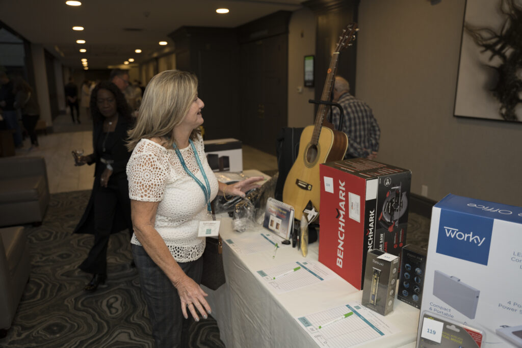 NLC Volunteer at the silent auction